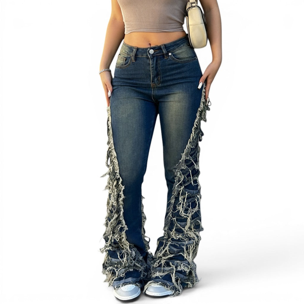 8O7 women's blue denim jeans with distressed fringe detailing on the legs and a slight stretch for comfort.
